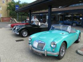 Paul examining Classic Cars for sale in Beaulieu